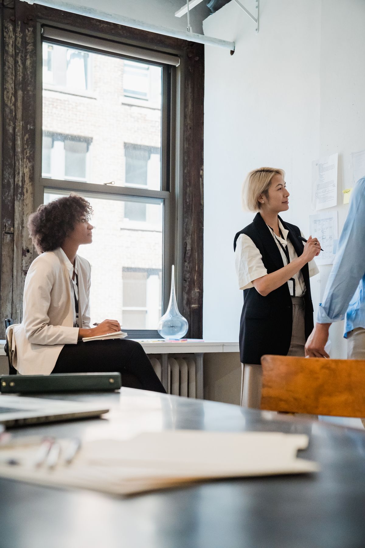 A small team collaborating together in a bright office